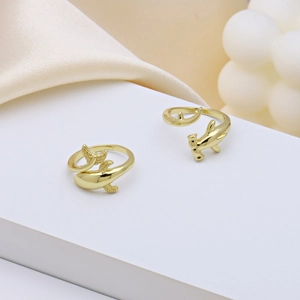 Golden whale and hammerhead shark adjustable open rings on white podium background