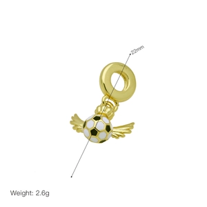 Macro shot of 22mm winged soccer charm with black and white enamel and gold finish