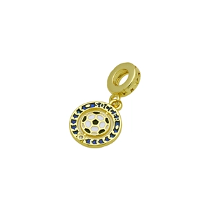Macro shot of gold-plated soccer charm with blue enamel ring and white soccer ball center