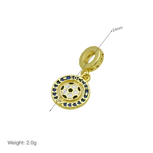 Golden soccer charm pendant with black and white enamel and blue star details