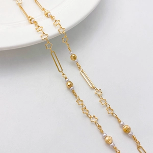 Detail of 14K gold-plated chain with stars and pearls for handmade DIY jewelry making
