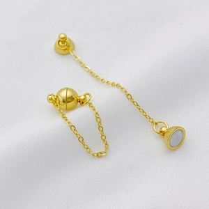 Detailed view of a 14K gold plated magnetic ball clasp connector for jewelry making