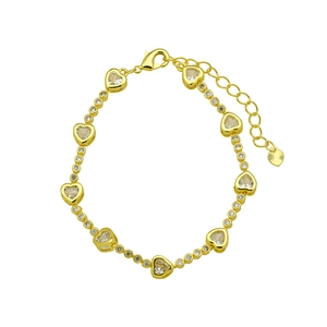 Detailed view of the lobster clasp, extension chain and heart charm on the golden bracelet