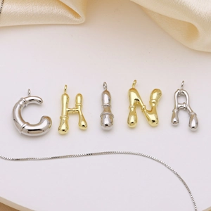 Golden and silver bubble alphabet initial pendants with polished bamboo texture finish