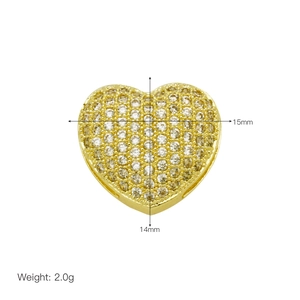 Macro detail of gold-plated heart charm with zircon pave setting and 15mm size specs