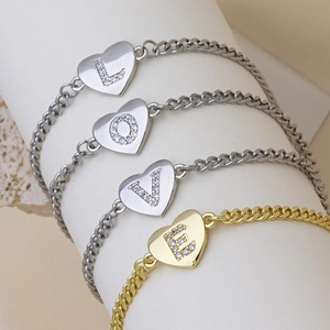 Golden and silver Cuban chain bracelets with heart-shaped crystal initial pendants