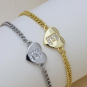 Gold and silver Cuban chain bracelets with heart pendants featuring zircon 'm' lettering