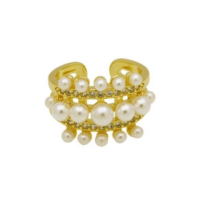 Detailed macro view of triple-layered gold open ring with pearls and rhinestones