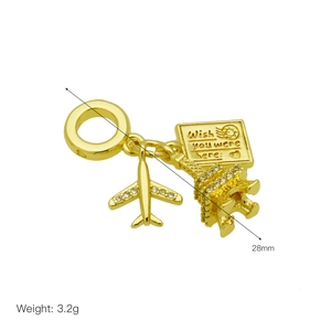 Golden airplane and Eiffel Tower dangle charm with Wish You Were Here postcard