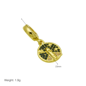 Detailed view of 23mm golden rocket charm with blue zircon for DIY bracelets
