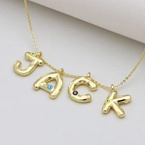 Gold evil eye initial necklace featuring JACK letter pendants with colorful charms