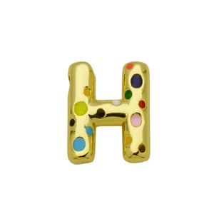 Macro shot of gold letter H balloon pendant with colorful polka dot enamel decoration