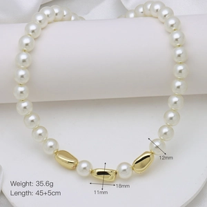Detail showing pearl necklace with golden beads, 45cm length and 12mm diameter pearls