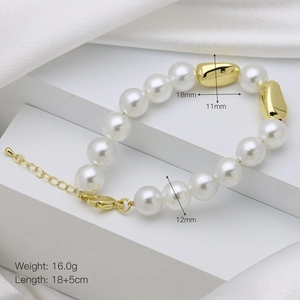 Detail of pearl bracelet with 12mm white pearls and 18mm golden metallic beads