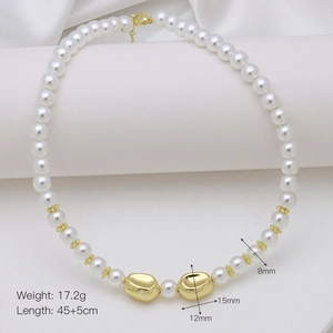 Macro detail of 8mm pearl necklace with golden irregular beads and lobster clasp closure