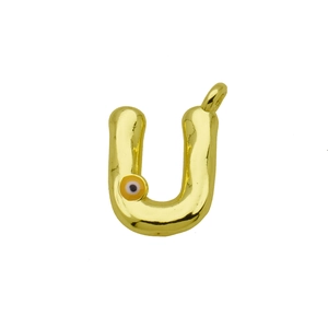 Detail of gold letter U pendant featuring a polished finish and small orange evil eye charm