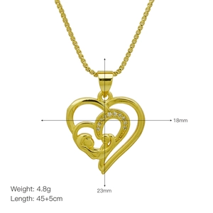 Detail showing gold heart mama necklace with size specs 23mm by 18mm and crystals