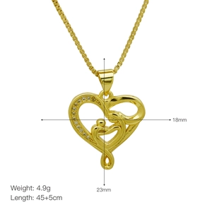 Macro detail of gold heart necklace with mother and child silhouette and white zircon stones