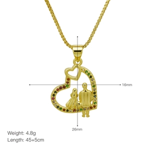 Detailed view of MAMA heart pendant with couple silhouette and colorful stones