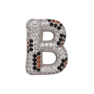 Macro shot of silver balloon letter B pendant with leopard pattern cubic zirconia pavé