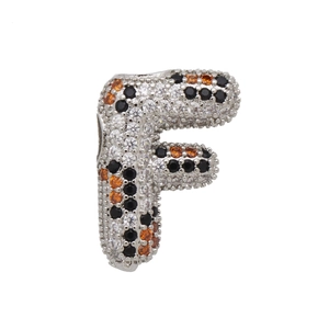 Macro shot of letter F pendant with pave-set white black and orange cubic zirconia