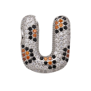 Macro detail of alphabet U pendant with silver pavé black, white and orange zirconias
