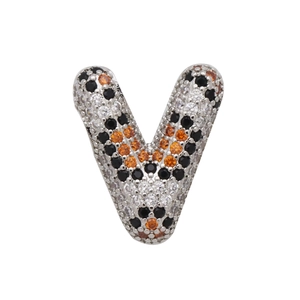 Detailed macro view of letter V bubble pendant with orange and black zircon leopard print