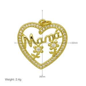 Detailed view of Mama heart pendant with clear zircons and floral accents in gold finish
