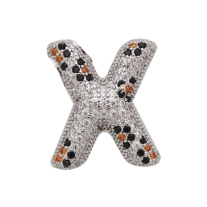 Detailed close-up of letter X bubble pendant with inlaid orange and black zircon stones