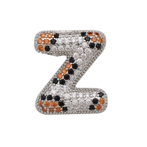 Detailed macro view of letter Z bubble pendant with white, black and orange zircon stones