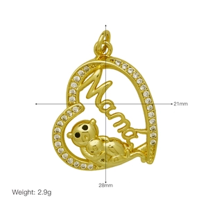 Detail showing gold Mama heart pendant size dimensions 21x28mm with cubic zirconia stones