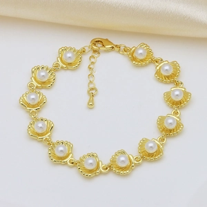 Elegant gold shell link bracelet with white pearls and adjustable lobster clasp chain