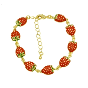 Detail of adjustable gold bracelet featuring nine red enamel strawberry charms and lobster clasp