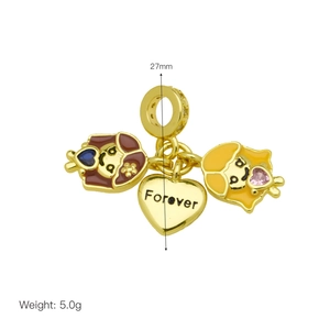 Detail of gold dangle charm with 'Forever' heart and colorful enamel girl pendants