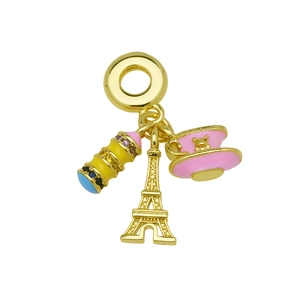 Detailed view of Eiffel Tower charm with pink tea cup and colorful crystals