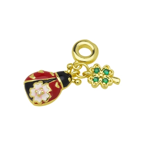 Detail of golden ladybug and four-leaf clover pendant with green crystals and enamel