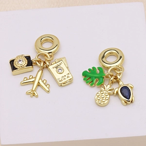 Golden travel and nature charms featuring airplane, passport, and sea turtle for bracelets