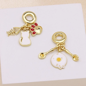 DIY gold alloy pendants featuring cat silhouette, fishbone, and breakfast egg themes