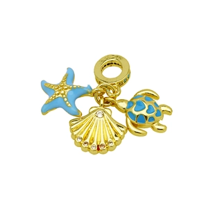 Gold ocean charms with starfish, shell, and turtle featuring blue enamel and crystals