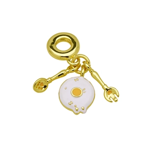 Detail view of gold charm with a tiny spoon, fork, and fried egg pendant for DIY bracelets