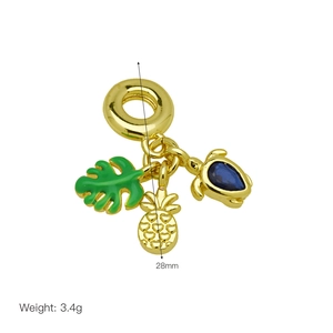 Detail of 28mm gold-plated pendants with turtle, pineapple, and green enamel leaf charms