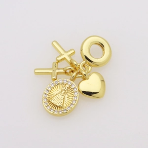 Detailed macro view of gold-plated religious charms featuring a Virgin Mary coin with crystals