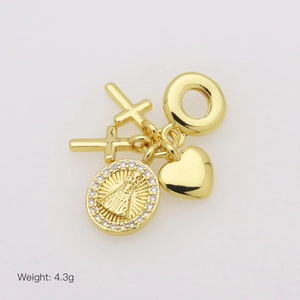 Detail of a 4.3g gold charm pendant with cross, heart, and zircon-studded medallion