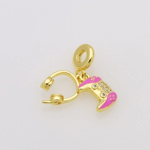 Detail of gold-plated gaming charm with a pink controller and headphone for bracelets