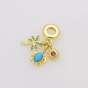 Close-up of golden beach charms featuring a palm tree, sea turtle and sun for a bracelet