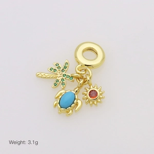 Detailed view of tropical charms featuring a coconut tree, sea turtle, and sun pendant