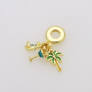 Detail of travel charms featuring a gold plane, martini glass, and palm tree pendant