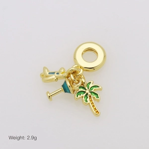 Detailed view of 2.9g gold charm with airplane, cocktail, and palm tree pendants