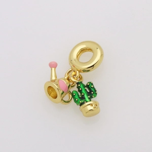 Detail of gold enamel watering can and cactus charms on a beach series bracelet