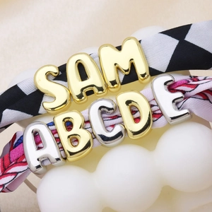 DIY bubble letter charms on fabric bands with gold and silver metallic alphabet beads